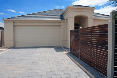 Sectional garage door with a tamper-proof locking mechanism
