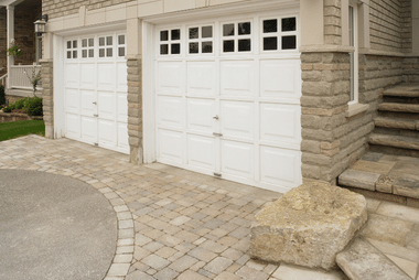 Sectional garage door complementing a contemporary home exterior