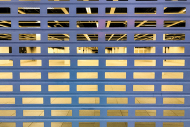 Security grille door for a commercial storefront