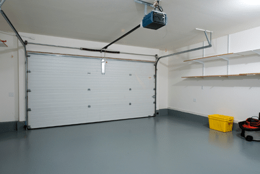 Insulated sectional garage door panel with a perforated design option