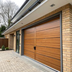 Sectional garage door with four horizontal panels mid-operation, tracks guiding it along the ceiling of a suburban home.