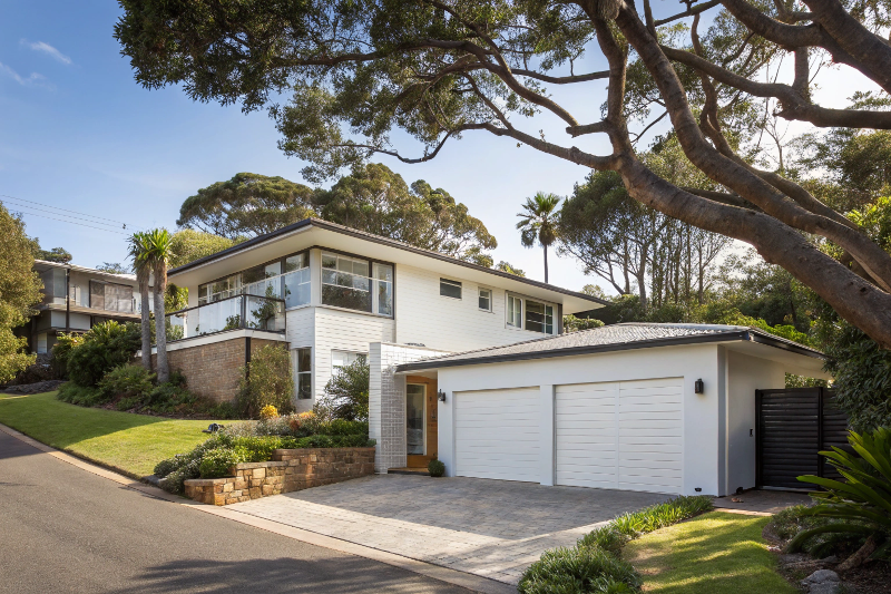 White tilt garage door installed on an Australian suburban home